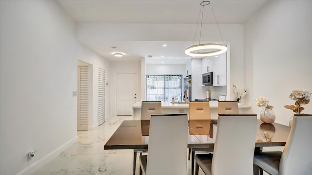 6320 Wedgewood Ter Unit 6320, Tamarac, FL 33321 - dining space with baseboards and marble finish floor