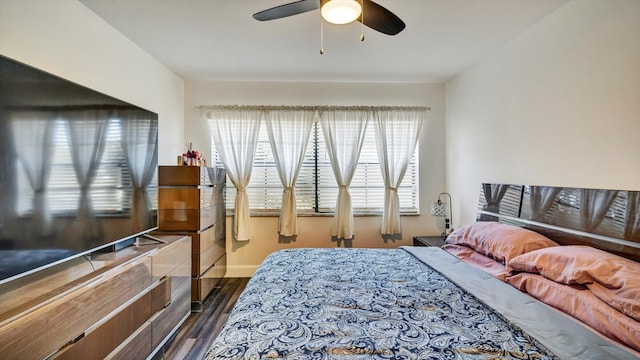 6320 Wedgewood Ter Unit 6320, Tamarac, FL 33321 - bedroom with baseboards, a ceiling fan, and dark wood finished floors