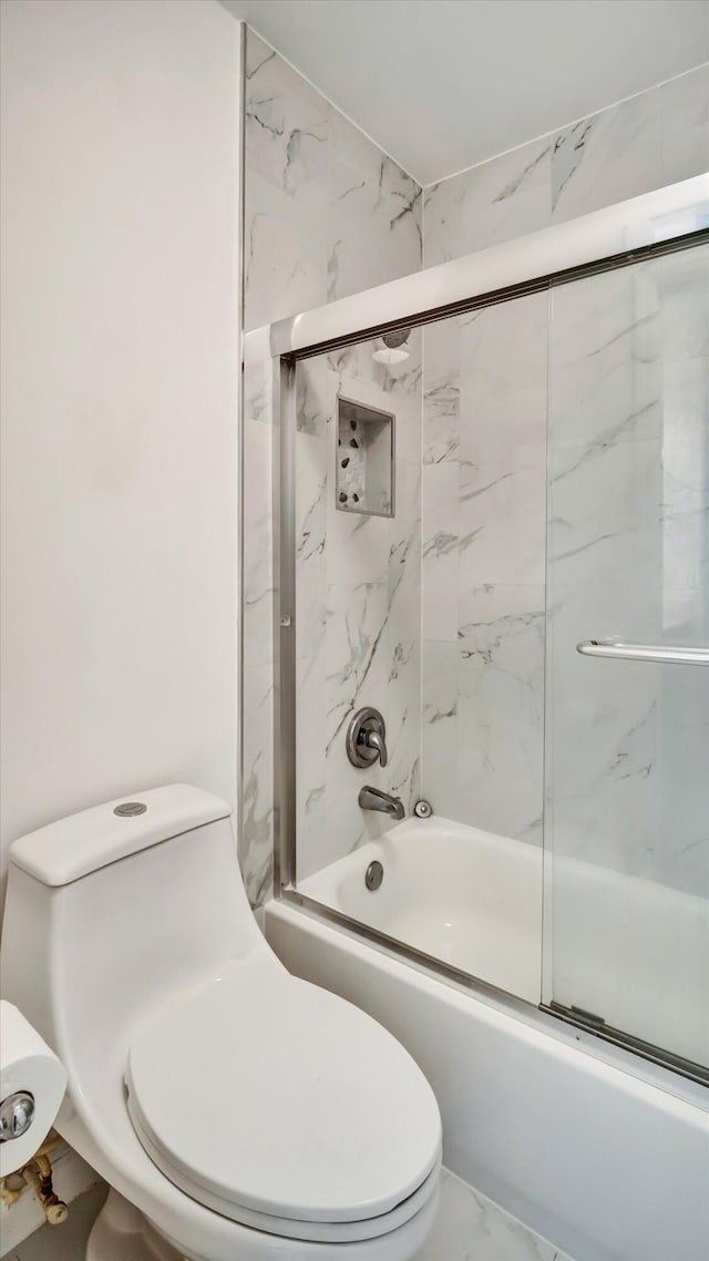 6320 Wedgewood Ter Unit 6320, Tamarac, FL 33321 - full bath with marble finish floor, combined bath / shower with glass door, and toilet