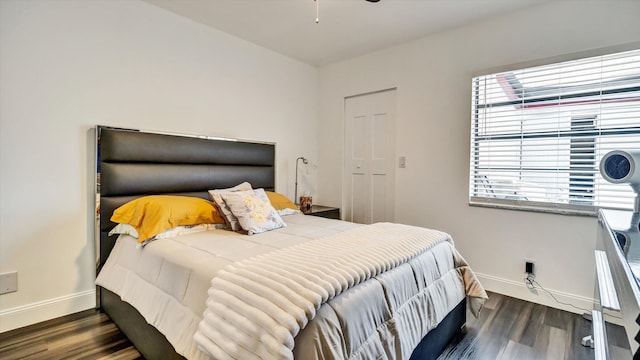 6320 Wedgewood Ter Unit 6320, Tamarac, FL 33321 - bedroom featuring baseboards, ceiling fan, and wood finished floors