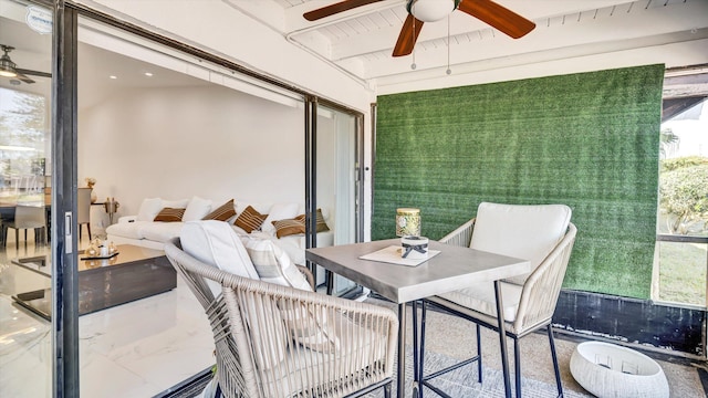 6320 Wedgewood Ter Unit 6320, Tamarac, FL 33321 - sunroom with outdoor dining area, ceiling fan, and beam ceiling