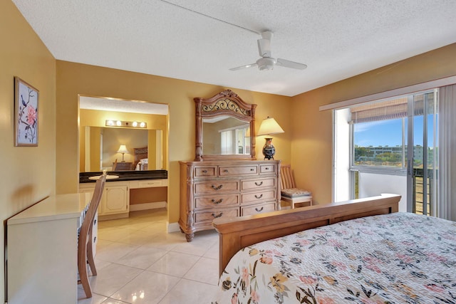 bedroom featuring connected bathroom, ceiling fan, a textured ceiling, baseboards, and light tile patterned floors