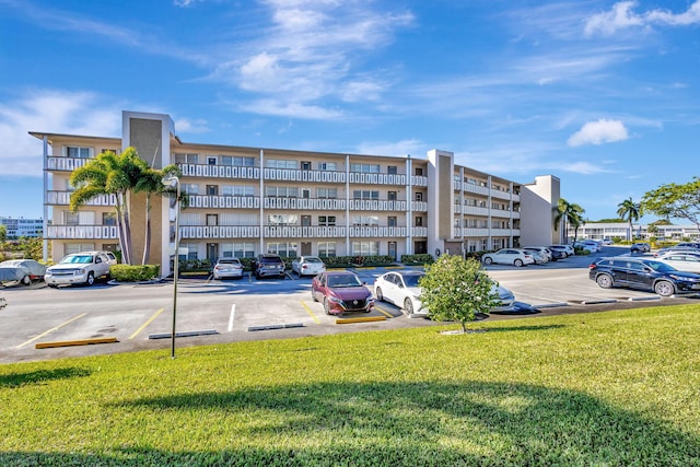 view of property with uncovered parking