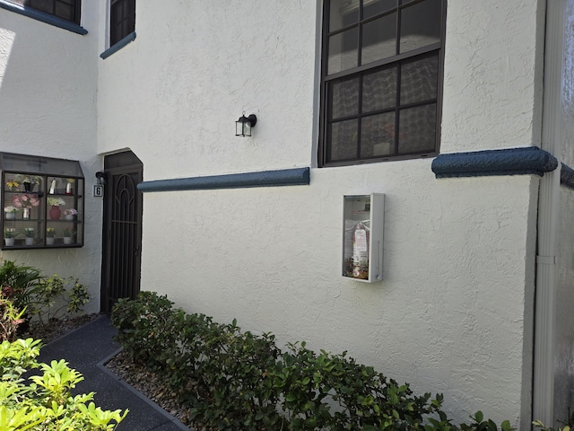 view of side of property with stucco siding