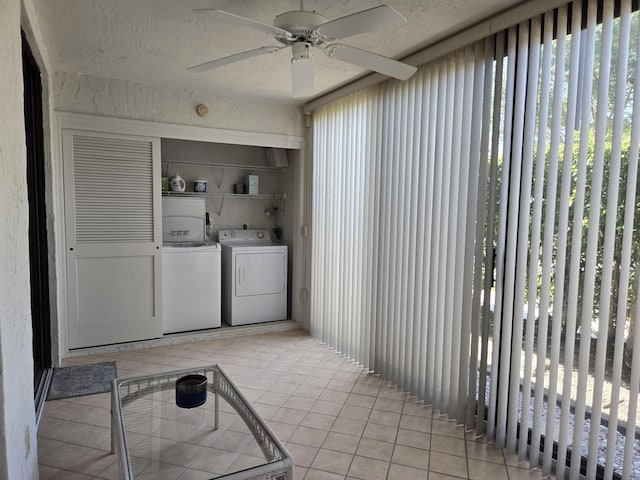 5135 Floria Dr Unit G, Boynton Beach, FL 33437 - laundry room featuring washer and dryer, light tile patterned floors, a ceiling fan, and healthy amount of natural light