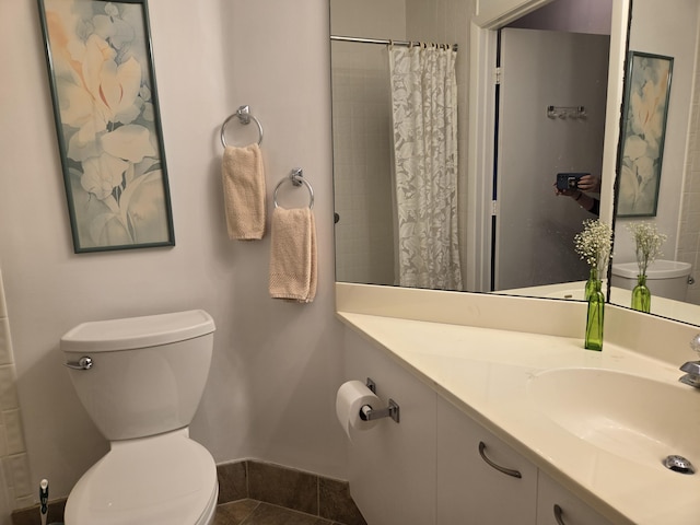 5135 Floria Dr Unit G, Boynton Beach, FL 33437 - bathroom with toilet, baseboards, and vanity