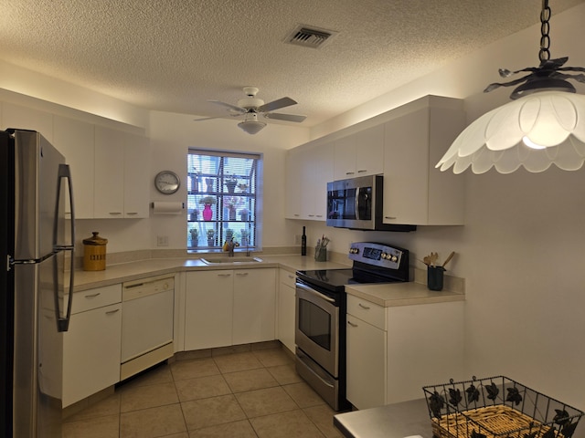 5135 Floria Dr Unit G, Boynton Beach, FL 33437 - kitchen featuring stainless steel appliances, ceiling fan, light countertops, white cabinetry, and light tile patterned flooring