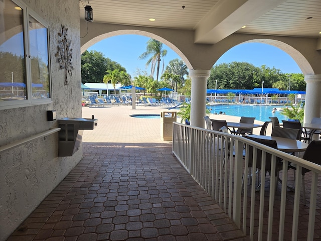 view of patio featuring a community pool