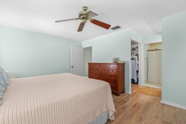 10124 182nd Ct S, Boca Raton, FL 33498 - bedroom with light wood finished floors, a closet, a spacious closet, and a ceiling fan