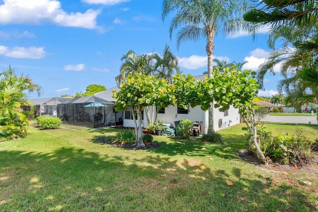 10124 182nd Ct S, Boca Raton, FL 33498 - view of green lawn with a lanai