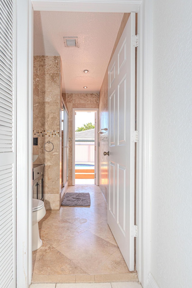 22031 SW 127th Ave, Miami, FL 33170 - full bath with toilet, a stall shower, a textured ceiling, and tile patterned floors