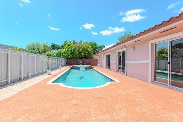 22031 SW 127th Ave, Miami, FL 33170 - view of pool featuring a patio area, a fenced backyard, and a pool with connected hot tub