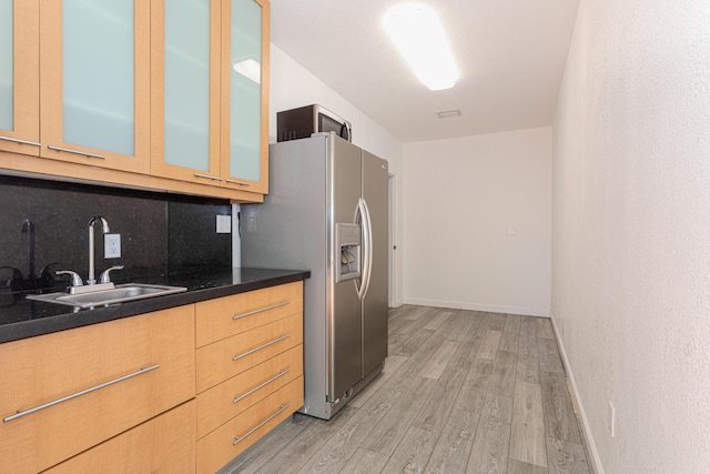 22031 SW 127th Ave, Miami, FL 33170 - kitchen featuring a sink, stainless steel fridge with ice dispenser, light wood-style floors, backsplash, and glass insert cabinets