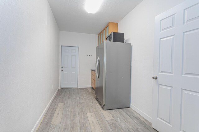 22031 SW 127th Ave, Miami, FL 33170 - washroom with light wood-style flooring and baseboards