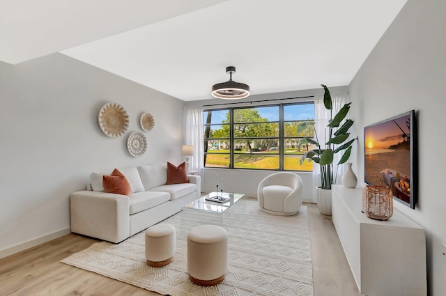 6049 Balboa Cir Unit 106, Boca Raton, FL 33433 - living area featuring baseboards and light wood-style flooring