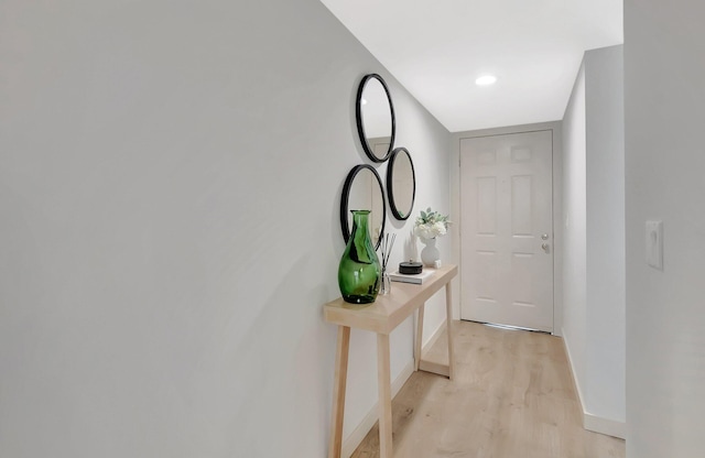 6049 Balboa Cir Unit 106, Boca Raton, FL 33433 - hallway featuring baseboards and light wood-style flooring