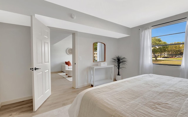 6049 Balboa Cir Unit 106, Boca Raton, FL 33433 - bedroom with baseboards and light wood finished floors