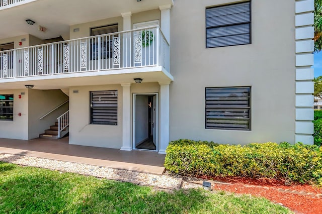 6049 Balboa Cir Unit 106, Boca Raton, FL 33433 - exterior space with stucco siding and a balcony