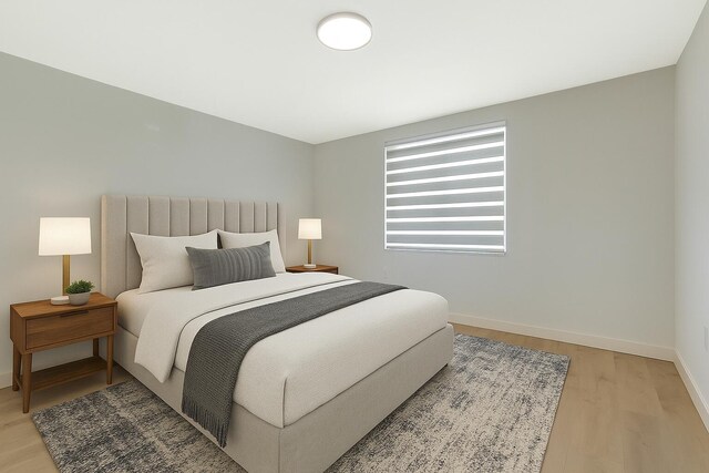 6049 Balboa Cir Unit 106, Boca Raton, FL 33433 - bedroom with baseboards and light wood finished floors