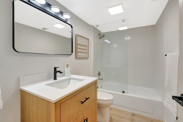 6049 Balboa Cir Unit 106, Boca Raton, FL 33433 - bathroom featuring wood finished floors, toilet, shower / bathing tub combination, and vanity