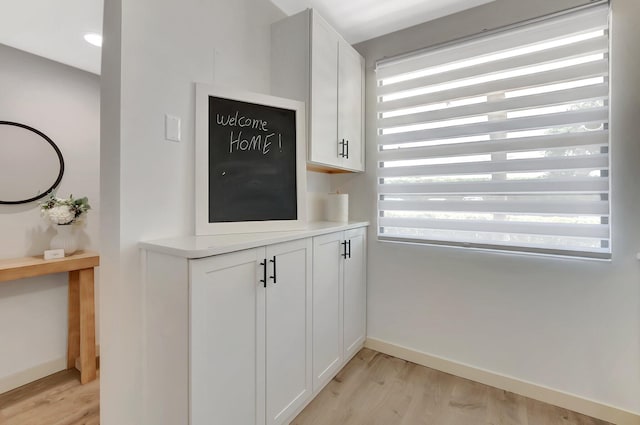 6049 Balboa Cir Unit 106, Boca Raton, FL 33433 - interior space with baseboards and wood finished floors