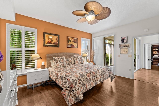 bedroom with baseboards, a ceiling fan, and wood finished floors