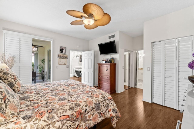 bedroom featuring access to outside, a ceiling fan, wood finished floors, ensuite bathroom, and visible vents