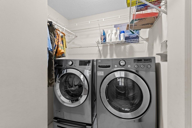 washroom featuring laundry area and separate washer and dryer
