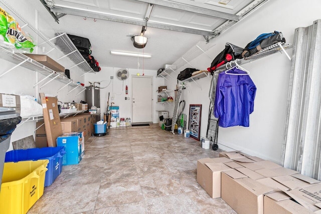 garage with a garage door opener and water heater