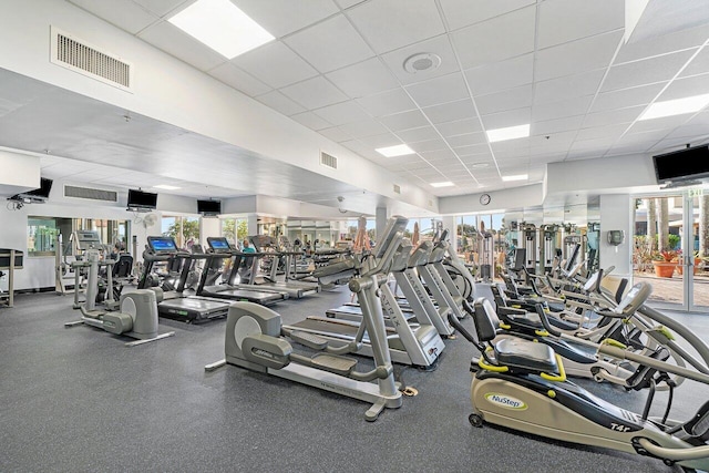 workout area featuring a paneled ceiling and visible vents