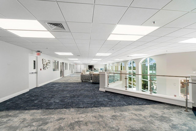 interior space featuring carpet floors, baseboards, and visible vents