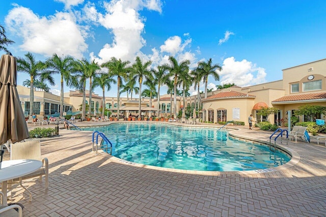 community pool with a patio area