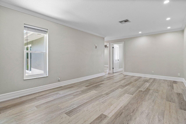 unfurnished room featuring visible vents, baseboards, light wood-style floors, ornamental molding, and recessed lighting