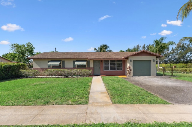 ranch-style home with an attached garage, a front lawn, stucco siding, and driveway