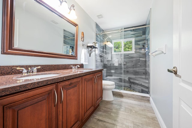 17225 Mare Ln, Loxahatchee, FL 33470 - bathroom featuring a stall shower, toilet, and double vanity