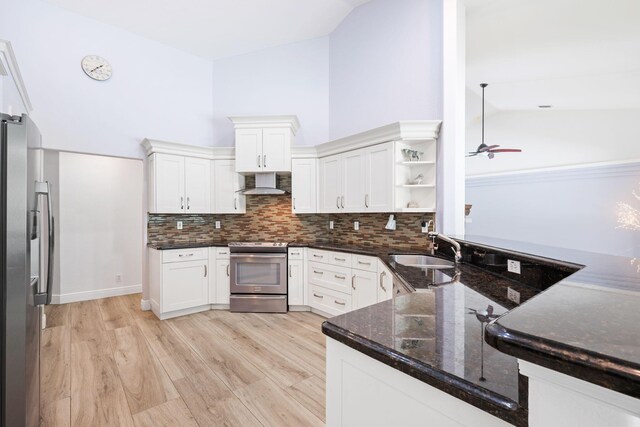 17225 Mare Ln, Loxahatchee, FL 33470 - kitchen featuring stainless steel appliances, wall chimney range hood, a sink, open shelves, and a ceiling fan