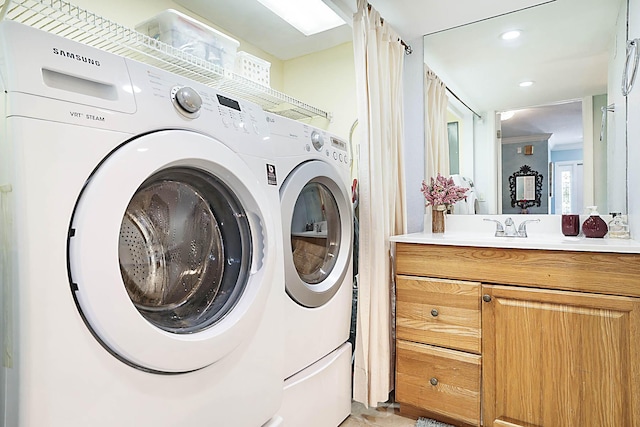 503 Vision Ct, Palm Beach Gardens, FL 33418 - laundry area with recessed lighting, laundry area, washing machine and dryer, and a sink
