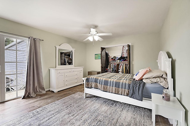 503 Vision Ct, Palm Beach Gardens, FL 33418 - bedroom featuring ceiling fan, access to exterior, baseboards, wood finished floors, and a spacious closet