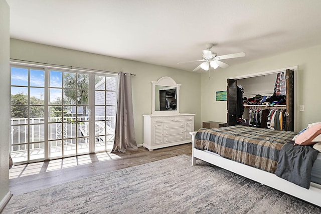 503 Vision Ct, Palm Beach Gardens, FL 33418 - bedroom with a walk in closet, a ceiling fan, wood finished floors, baseboards, and a closet