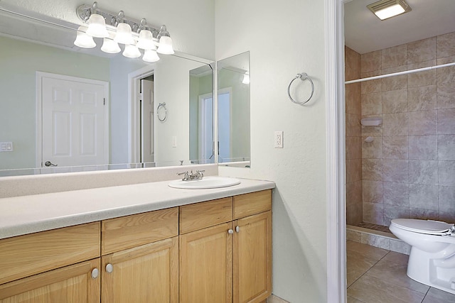 503 Vision Ct, Palm Beach Gardens, FL 33418 - bathroom featuring tile patterned flooring, vanity, toilet, and tiled shower