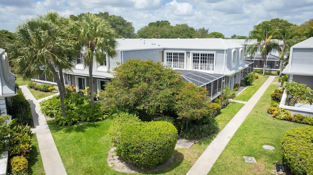 503 Vision Ct, Palm Beach Gardens, FL 33418 - back of property with a lawn