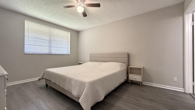 2925 SW 22nd Ave Unit 2030, Delray Beach, FL 33445 - bedroom with dark wood finished floors, a textured ceiling, baseboards, and ceiling fan