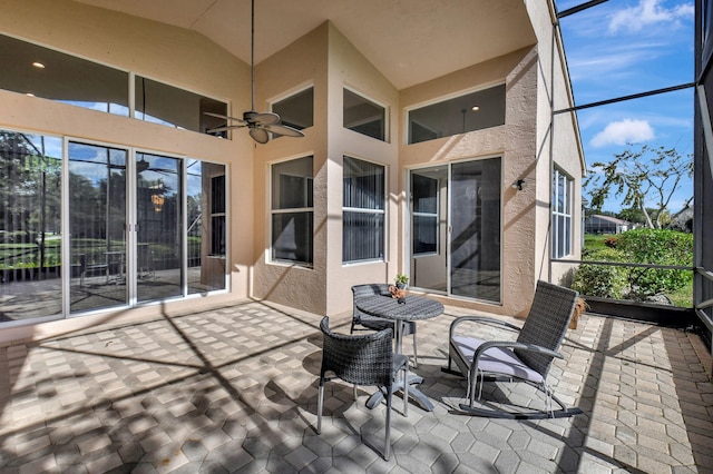 exterior space with ceiling fan