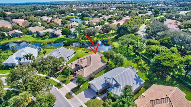 bird's eye view with a residential view and a water view