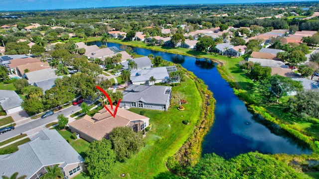 bird's eye view featuring a residential view and a water view