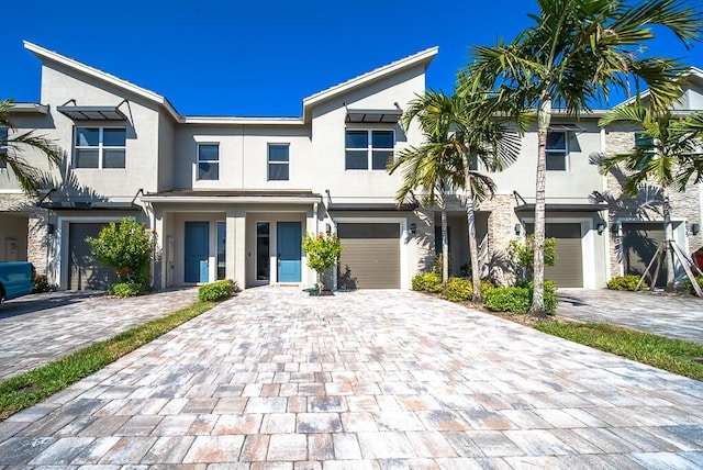 8633 Via, Mar Rosso, Lake Worth, FL 33467 - multi unit property with decorative driveway, a garage, and stucco siding