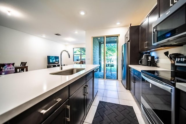 8633 Via, Mar Rosso, Lake Worth, FL 33467 - kitchen featuring recessed lighting, a sink, appliances with stainless steel finishes, and light countertops