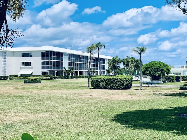 view of community featuring a yard