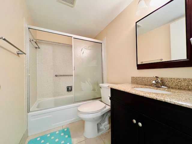 bathroom featuring visible vents, tile patterned flooring, vanity, toilet, and enclosed tub / shower combo