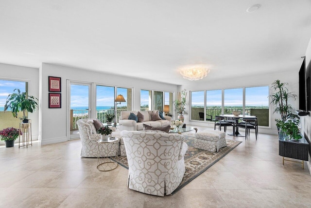 4001 N Ocean Blvd Unit 1108, Boca Raton, FL 33431 - living area featuring a chandelier, light tile patterned flooring, and baseboards